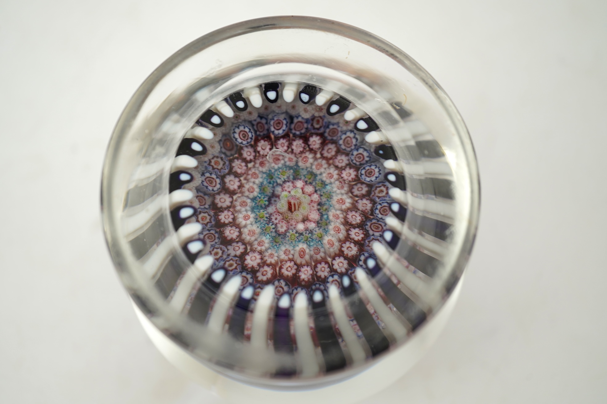 A Clichy piedouche concentric millefiori paperweight, mid 19th century